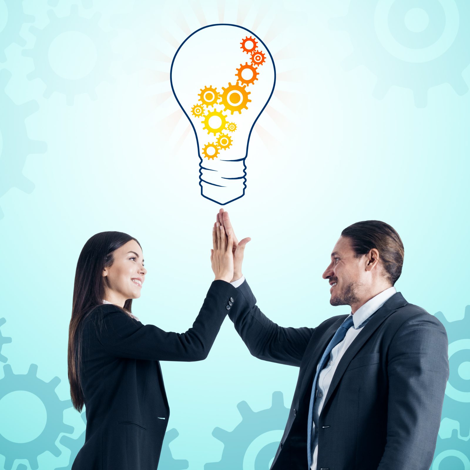 Two business people high-fiving under a drawn lightbulb filled with orange and yellow gears