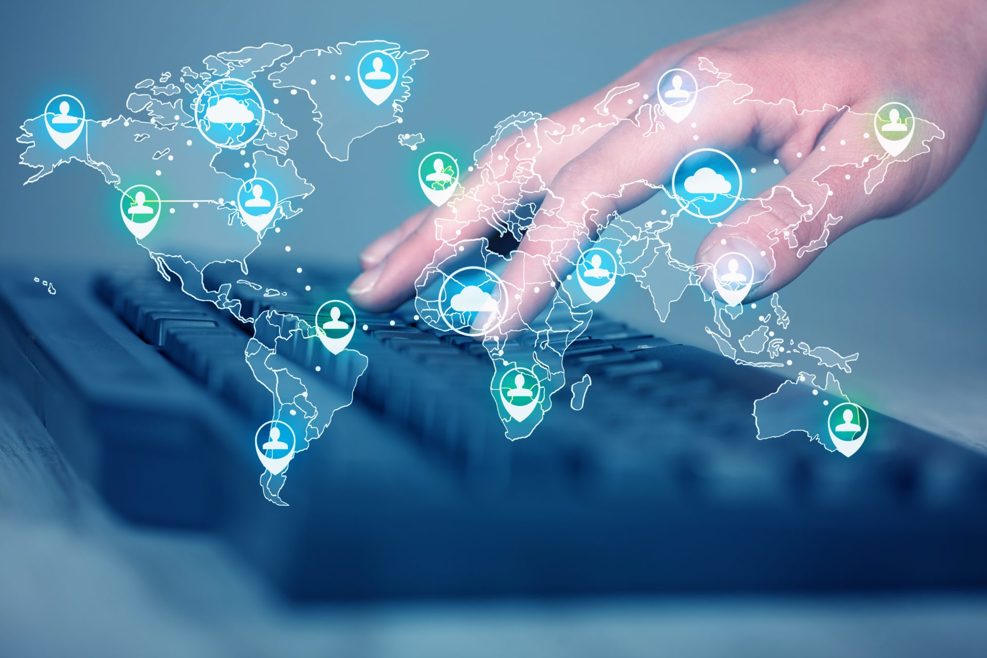 Hand typing on a keyboard with a glowing world map and contact location pins